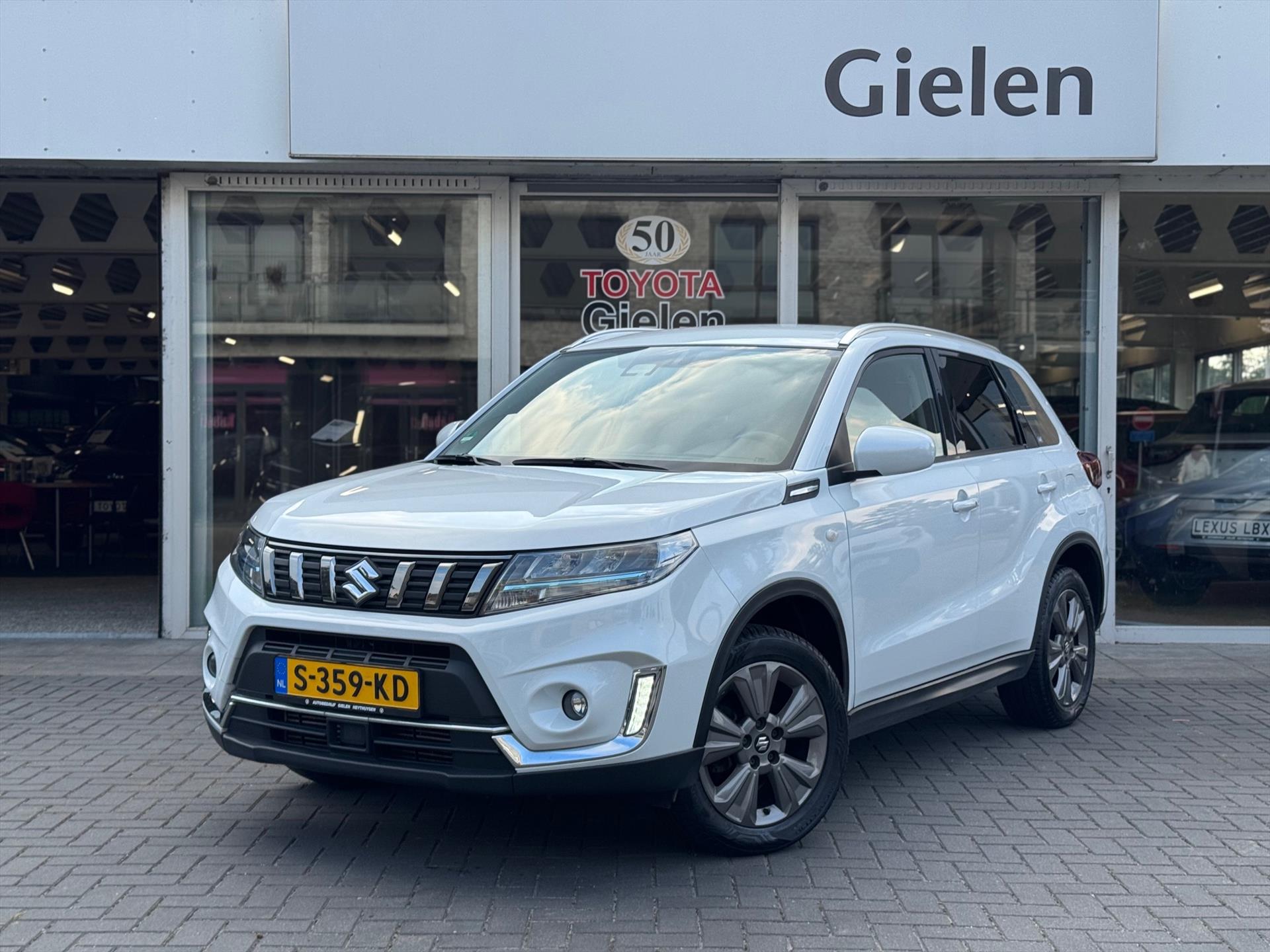 Suzuki Vitara 1.4 Boosterjet Smart Hybrid Automaat Select | Trekhaak, Apple CarPlay/Android Auto, Stoelverwarming, Adaptive cruise control, 1. 47830302-0.jpg | Autobedrijf Gielen