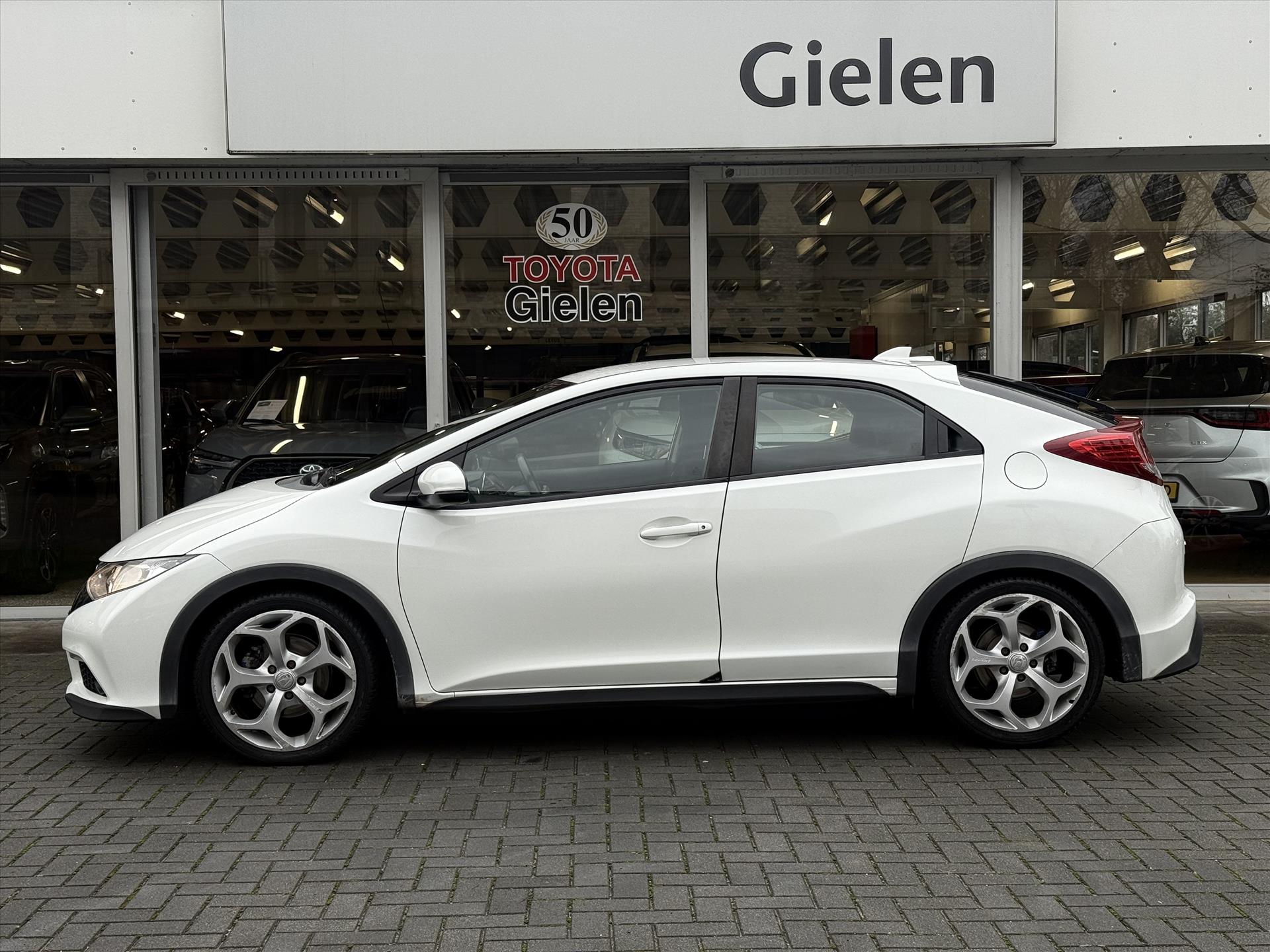Honda Civic 1.4 100pk Sport | Trekhaak, Navigatie, Parkeercamera, Cruise control, 17 inch, Airconditioning 49428331-1.jpg | Autobedrijf Gielen
