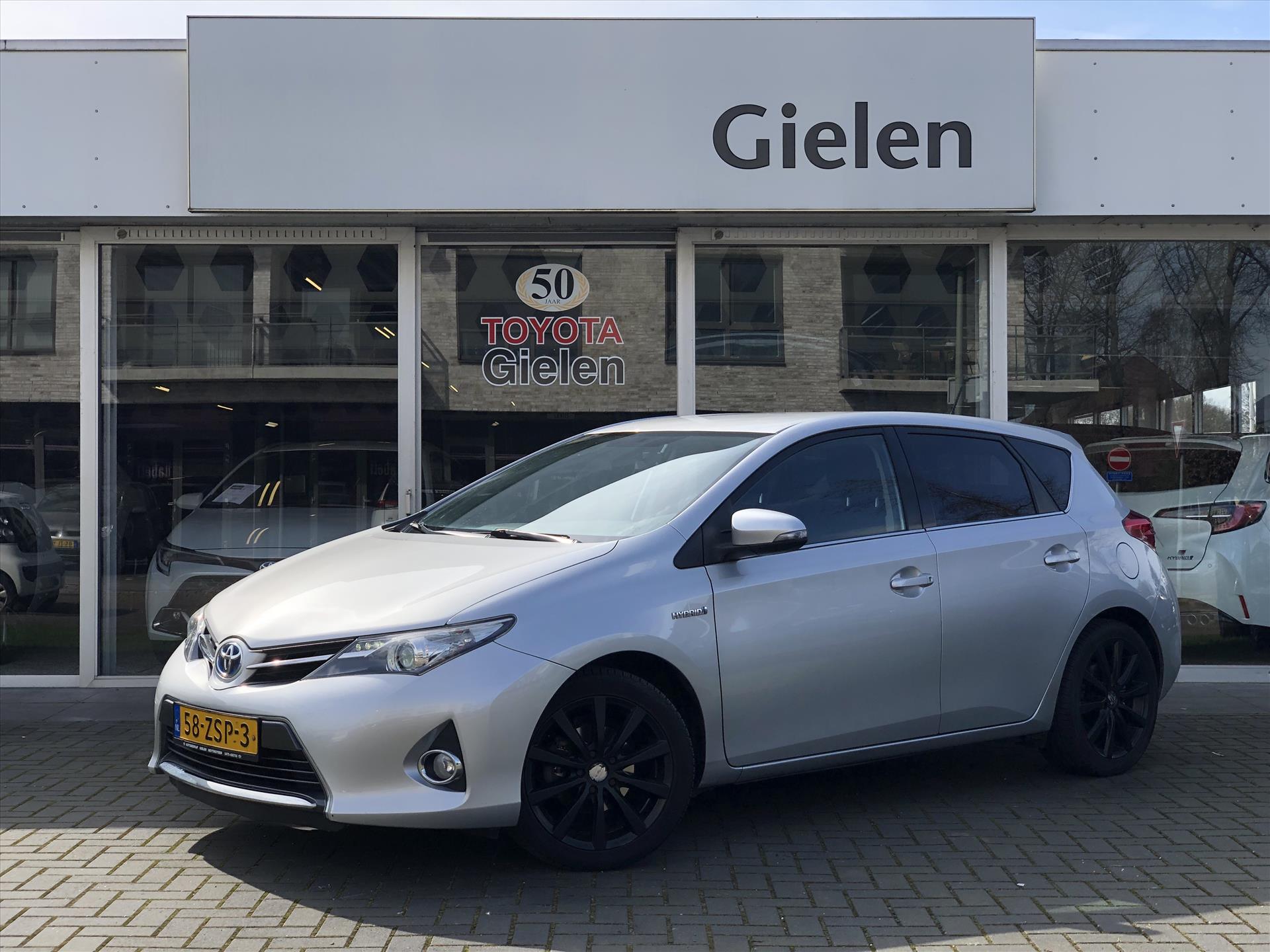 Toyota Auris 1.8 Hybrid Aspiration | Trekhaak, Lichtmetalen velgen, Cruise control, Parkeercamera, Bluetooth, Climate control 37510467-0.jpg | Autobedrijf Gielen