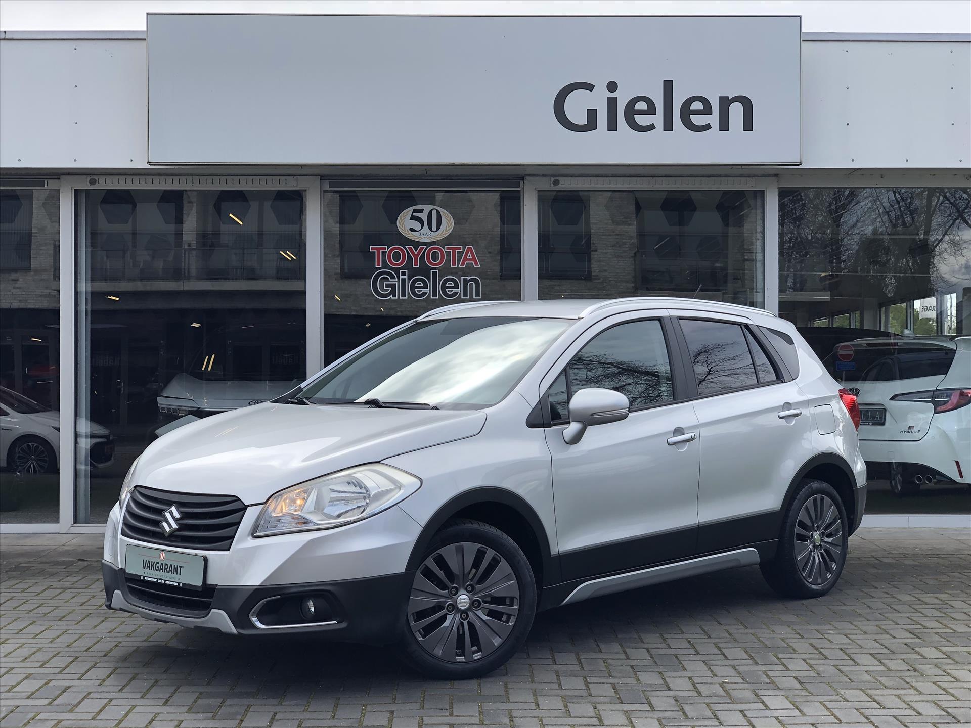 Suzuki S-Cross 1.6 VVT 120pk Exclusive | Trekhaak, Cruise control, 17 inch, Climate control, Stoelverwarming, 2e eigenaar 38011611-0.jpg | Autobedrijf Gielen
