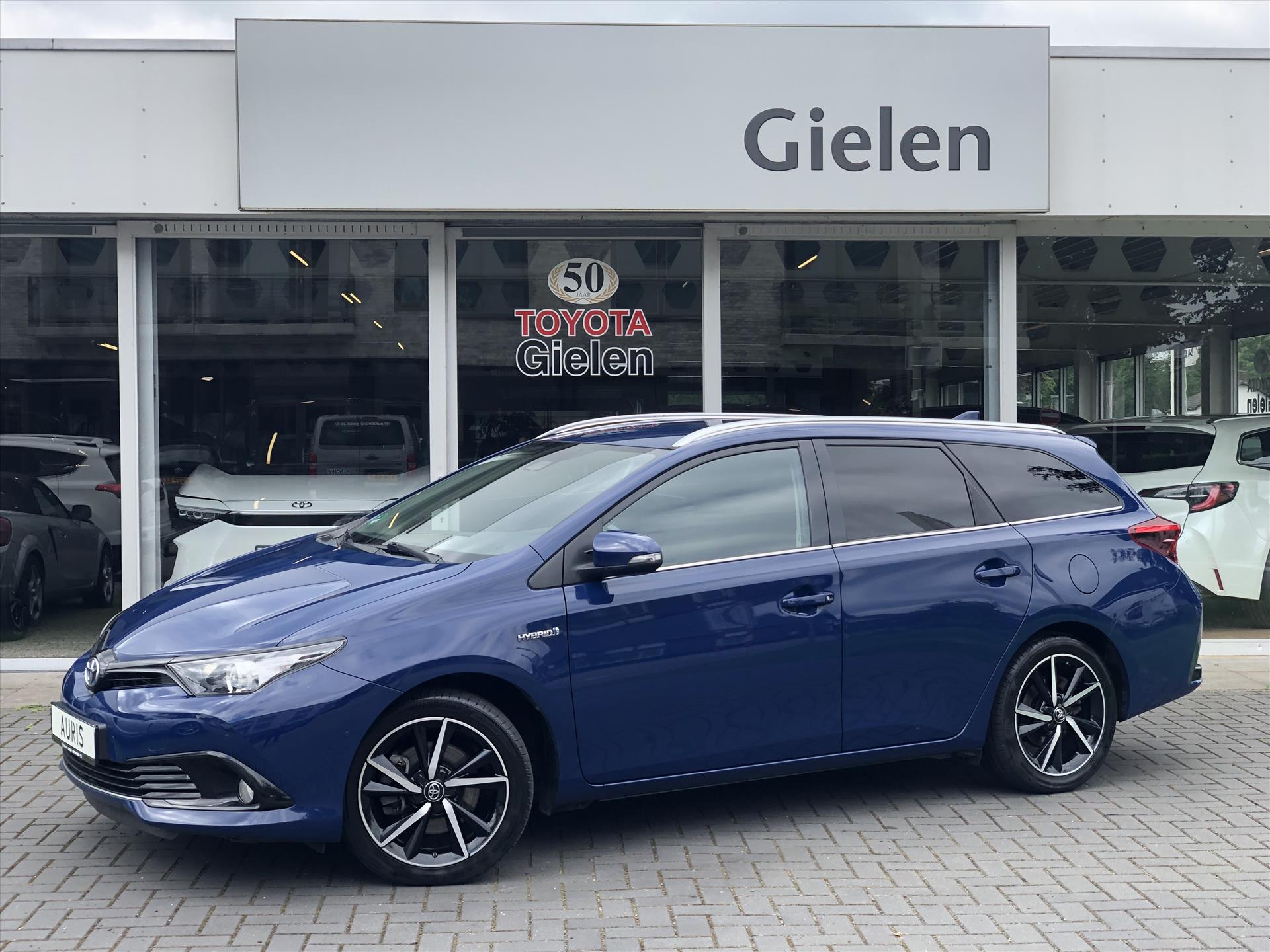 Toyota Auris Touring Sports 1.8 Hybrid Dynamic Ultimate | Navigatie, Parkeersensoren, Stoelverwarming, Keyless, DAB, 17 inch 38104785-0.jpg | Autobedrijf Gielen