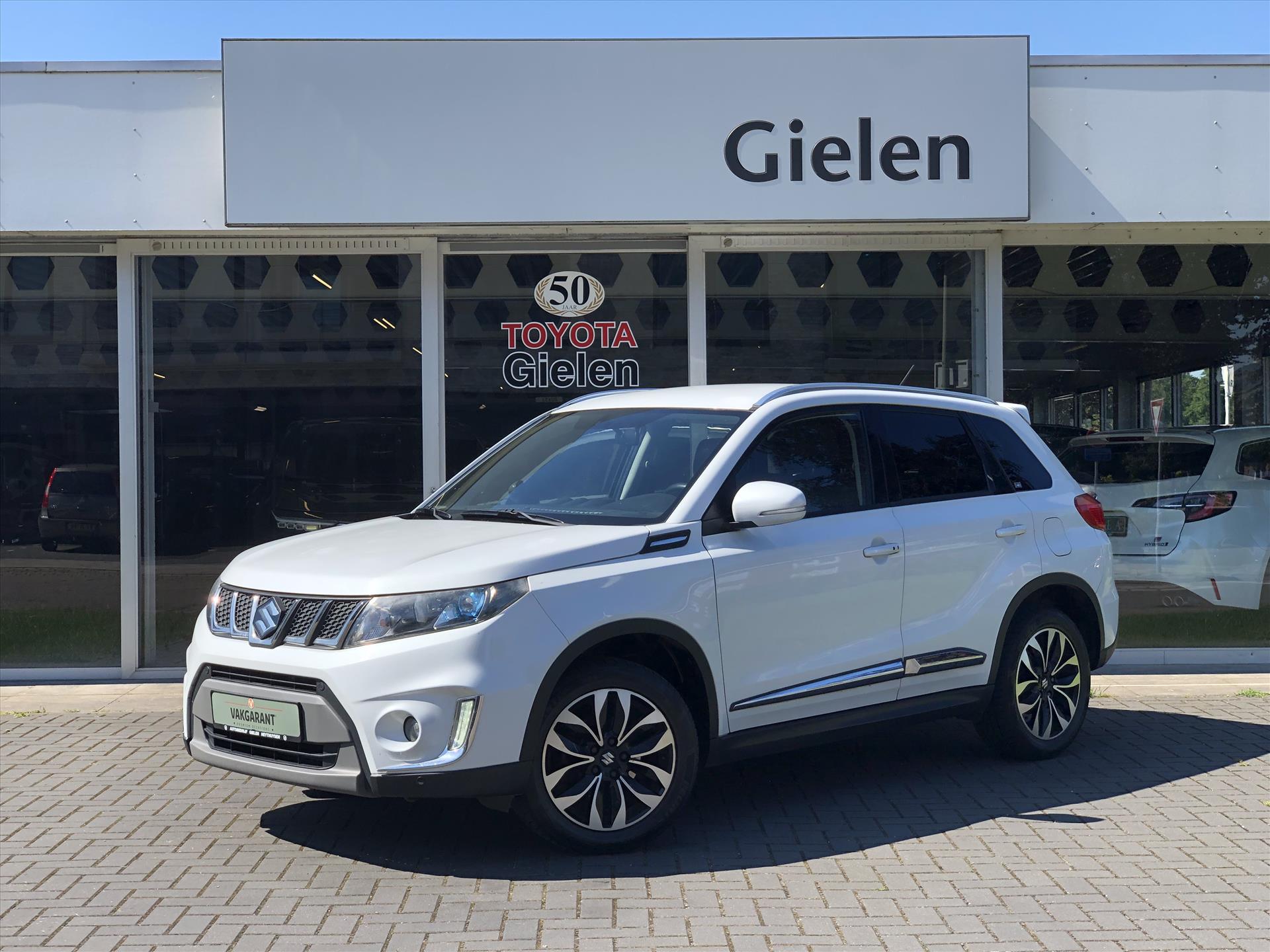 Suzuki Vitara 1.6 VVT AllGrip Executive Automaat | Trekhaak, Half Leer, Stoelverwarming, Adaptive Cruise Control, Navigatie, Parkeersensoren, 38941425-0.jpg | Autobedrijf Gielen