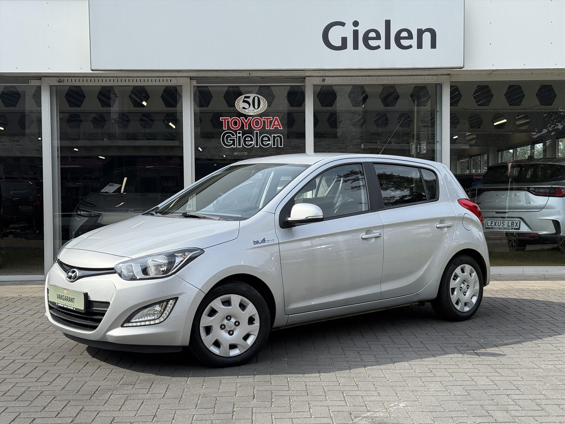 Hyundai i20 1.2i 85PK 5D i-Motion | Trekhaak, Airconditioning, Stuurbediening, Centrale deurvergrendeling, Elektrische ramen 46823495-0.jpg | Autobedrijf Gielen